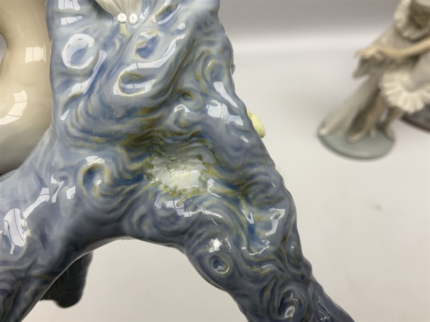 Four Lladro figures, comprising Touch of Class no 5377, Boy Student no 4517, Ocean Beauty no 5785 and Carnival Couple no 4882, largest example H45cm