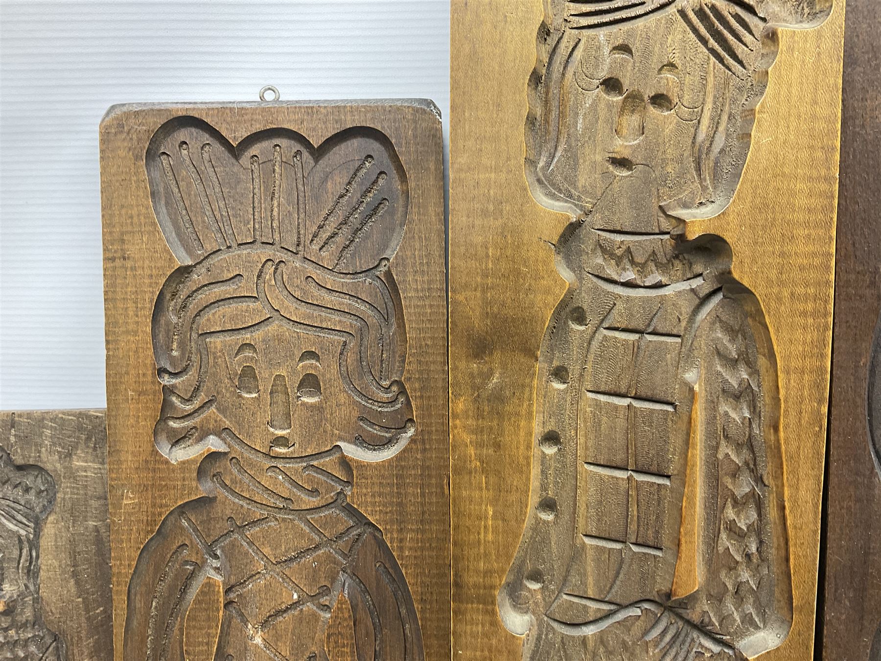 Six 20th century hardwood Dutch folk art Speculaasplank or biscuit moulds, typically carved with figures in traditional dress, largest H101cm