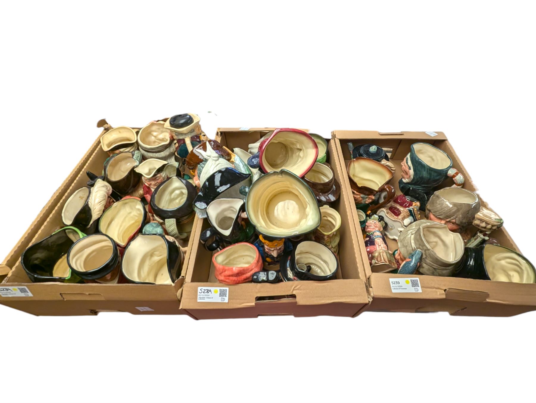 Collection of character and toby jugs and teapots, mostly Royal Doulton examples, in three boxes 