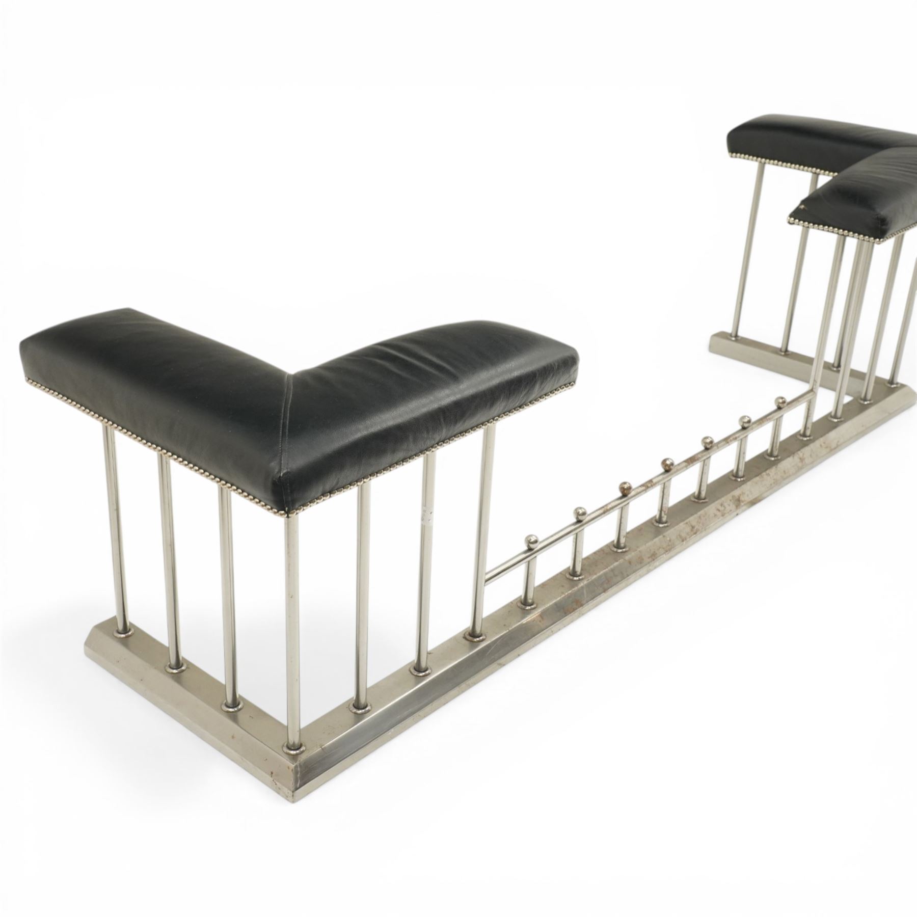 20th century steel club fender, with black leather seats above a steel frame