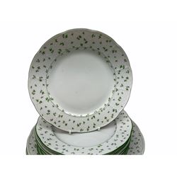 Eight dinner and eight side plates by Thun with a leaf design, along with eight dinner plates with a floral design, along with a ladies wrist watch. 