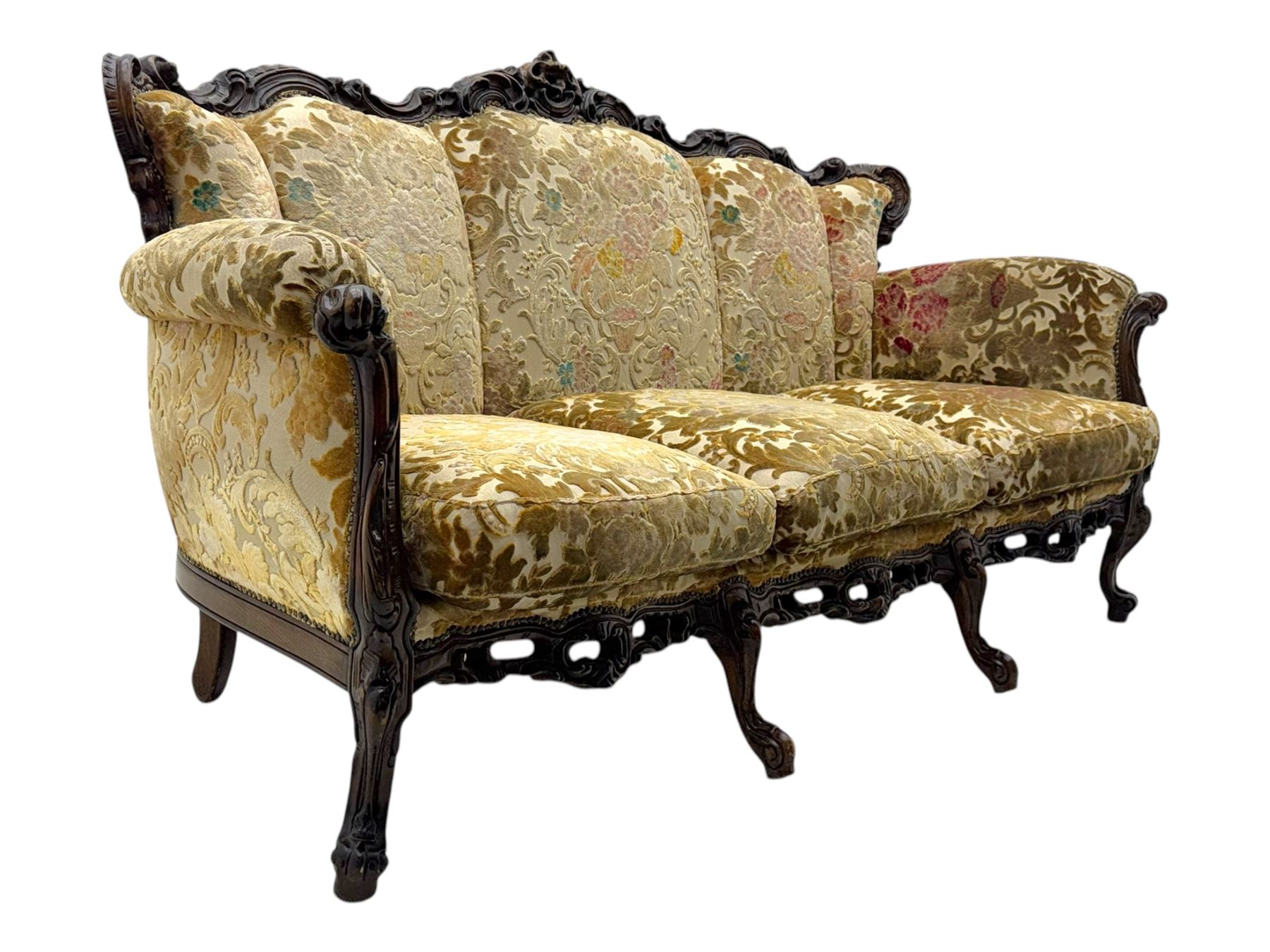 Victorian design stained wood three seater settee, top rail carved and scrolled, padded back and arms, scrolled cabriole feet 