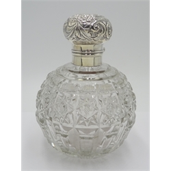  Edwardian silver mounted globular cut glass scent bottle decorated with embossed flowers and foliate scrolls, internal stopper by J Collyer & Co Ltd, Birmingham 1903 H15.5cm  