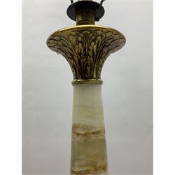 Two heavy oynx and brass mounted table lamps, with acanthus capped tapering columns raised upon square stepped bases with foliate decoration, both with tasselled fabric shades, tallest H97cm incl shade