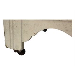 20th century painted pine chest of drawers, rectangular top over two short and two long drawers, scalloped apron, on castors