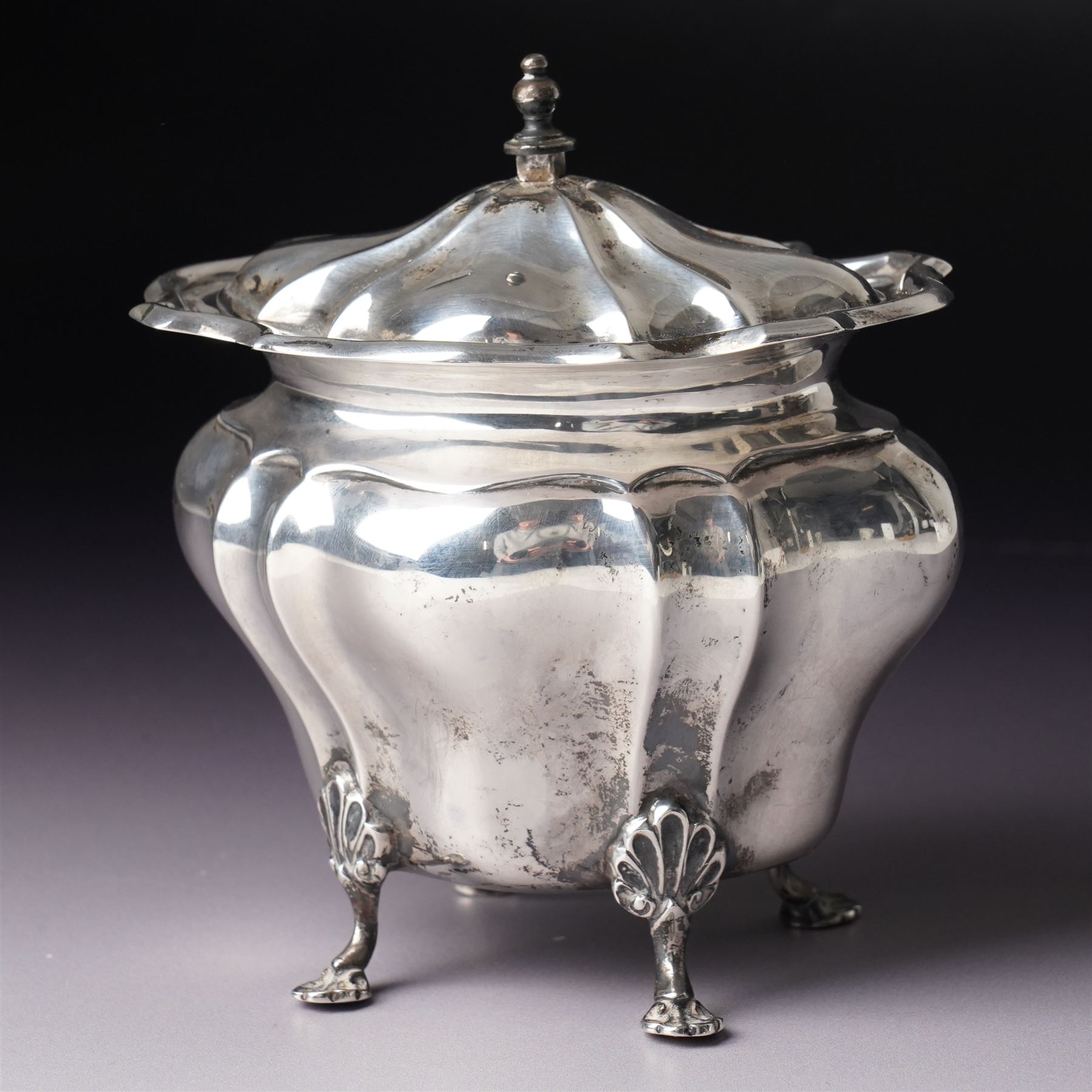 Edwardian silver tea caddy of fluted oval form with shaped supports Sheffield 1903 Maker Walker & Hall  