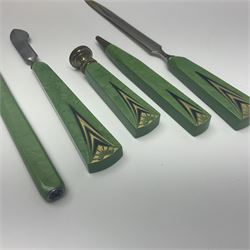 French Art Deco desk set in original fitted case comprising propelling pencil, letter opener, seal, letter knife and scribe, each with green phenolic handle with gilt detail