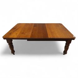 Victorian mahogany extending dining table, rectangular top with chamfered corners above a plain frieze raised on turned reeded legs with castors and two additional leaves, 197cm fully extended, and a set of six early 20th century oak upholstered chairs with drop-in seats, arched panelled back splat and close studded border on turned front legs joined by stretchers, 47x41x109cm 