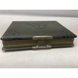 Victorian desk ink blotter, decorated with painted spray of flowers within stylised gilt rococo spandrels with mother of pearl fixings, together with a Victorian photo album containing interior leaves with apertures of various sizes and shapes of portraits surrounded by printed sea and dock scenes, blotter L28cm