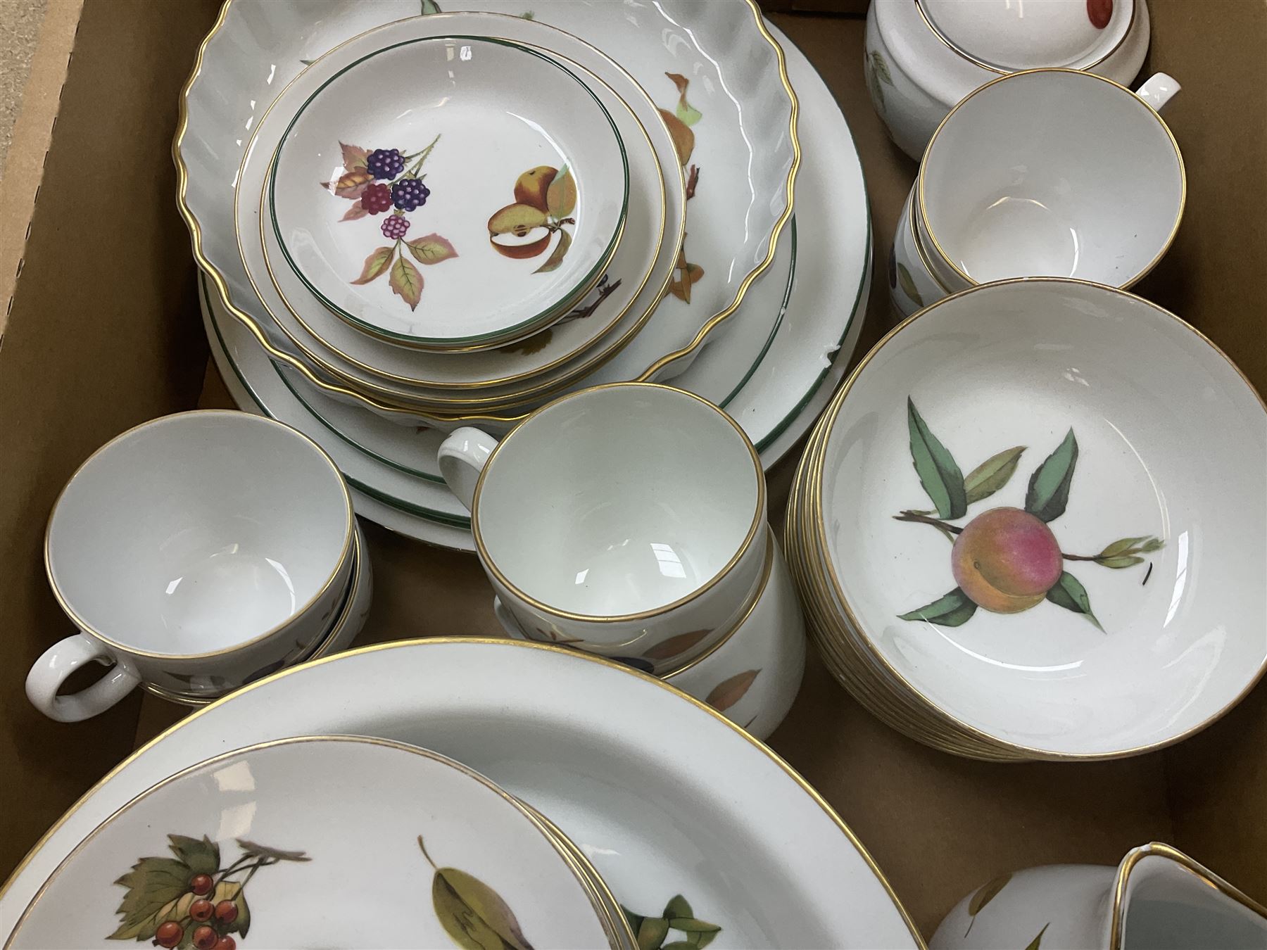 Royal Worcester Evesham and Evesham Vale tea and dinner wares, to include, three large covered tureens, coffee pot, eight tea cups and saucers, milk jug, two covered sucriers, boxed serving spoons etc, approx .130