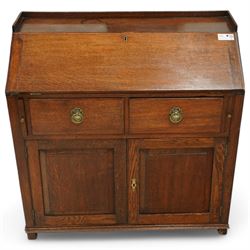 George III oak bureau, fall front enclosing fitted interior, two drawers over double panel...