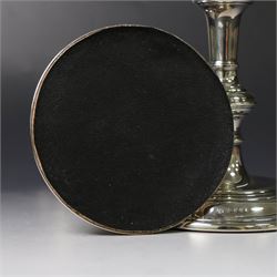 Pair of silver candlesticks, with knopped stems and upon spreading circular weighted bases, hallmarked William Comyns & Sons Ltd, London 1979, H20cm