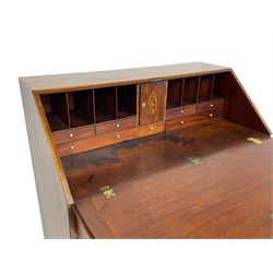 George III mahogany bureau, the fall-front banded and with boxwood stringing, enclosing fitted interior with pigeonholes and drawers surrounding a central cupboard with inlaid shell motif, the base with four graduating cock-beaded drawers, each with pressed brass handle plates with central lion masks and ivory escutcheons, on shaped bracket feet
This item has been registered for sale under Section 10 of the APHA Ivory Act