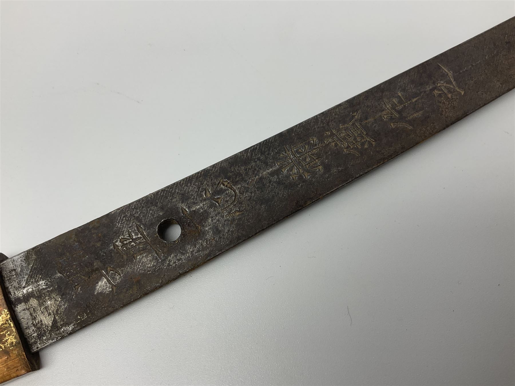 WW2 Japanese Army officer's shin gunto/katana sword with 68.5cm steel single edged blade, foliate cast brass tsuba, bound fish-skin grip with brass mounts, inscribed marks to both sides of tang; in lacquered wooden scabbard with brass mounts and locking button L97cm overall