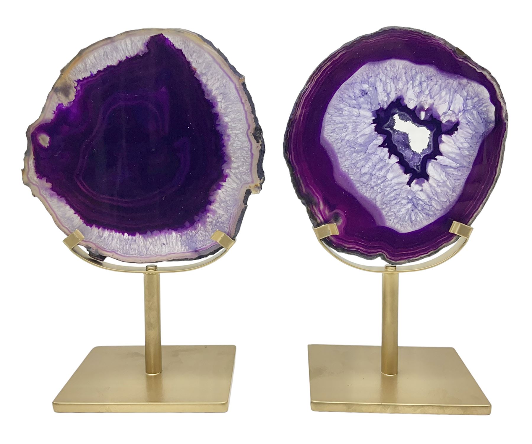 Pair of purple agate slices, polished with rough edges, raised upon gilt metal stands