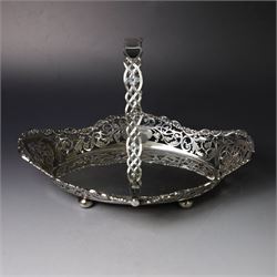 Early 20th century swing handled basket, of oval form with pierced sides and floral C scro...