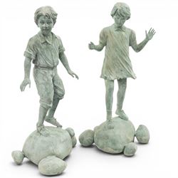 After Eneri Prosperi, bronze garden child statues, depicting children balancing on rock-fo...