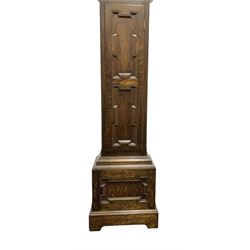 8-day oak longcase clock - in an early 18th century styled case with a caddy top, square hood door with barley twist columns, long carved trunk door on a conforming plinth with an applied skirting base, square brass dial with an engraved centre, silvered chapter and spandrels, 19th century rack striking movement, striking the hours on a bell. With weights and pendulum.