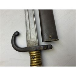 French model 1866 sabre bayonet, the 57.5cm curving blade marked St. Etienne 1868; in associated steel scabbard L71cm overall