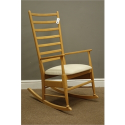  Beech framed rocking chair with upholstered seat   