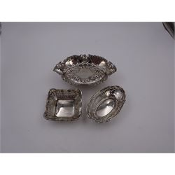 Three pierced silver bon bon dishes, including navette shaped example upon four pad feel, all hallmarked, together with a 1920s silver mounted manicure set, hallmarked G & C Ltd, Birmingham 1925, in fitted case 