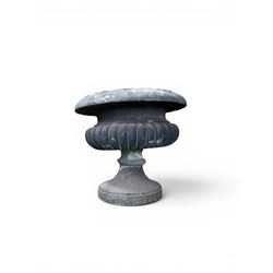 Carved sandstone garden urn, gadrooned campana form