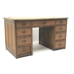  Edwardian oak twin pedestal desk, leather inset top, eight short and one long drawer, W122cm, H69cm, D67cm  