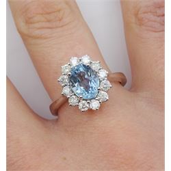 18ct white gold oval aquamarine and round brilliant cut diamond cluster ring, hallmarked, aquamarine approx 1.30 carat, total diamond weight approx 0.60 carat