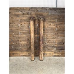 Matched pair of 19th century hardwood architectural columns with carved capitols, column diameter 18cm