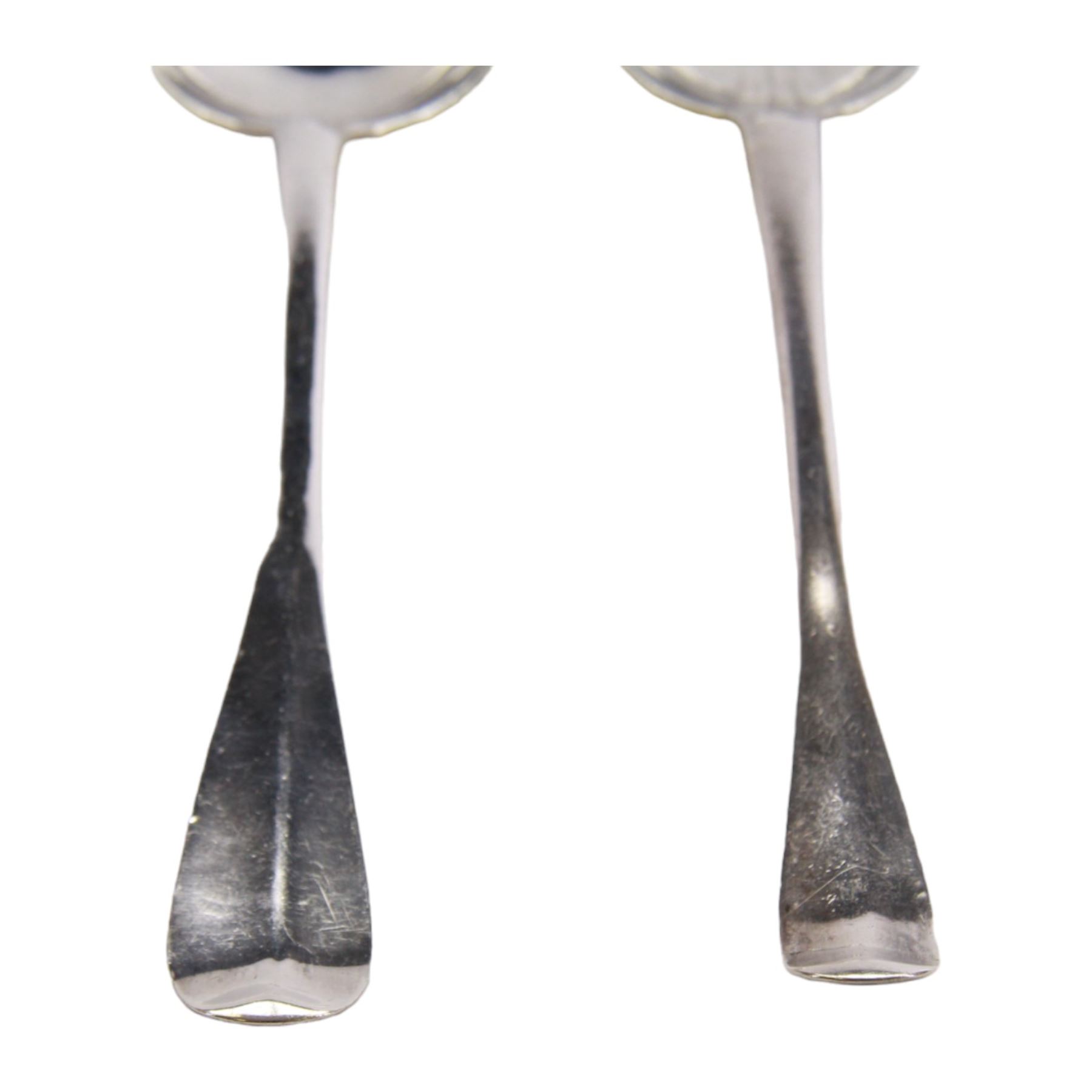 Two early/mid 18th century American silver Hanovarian pattern tablespoons with rat tail bowls, the first example marked for John Burt, Boston, circa 1730, the second marked for George Hanners, Boston, each approximately L19cm