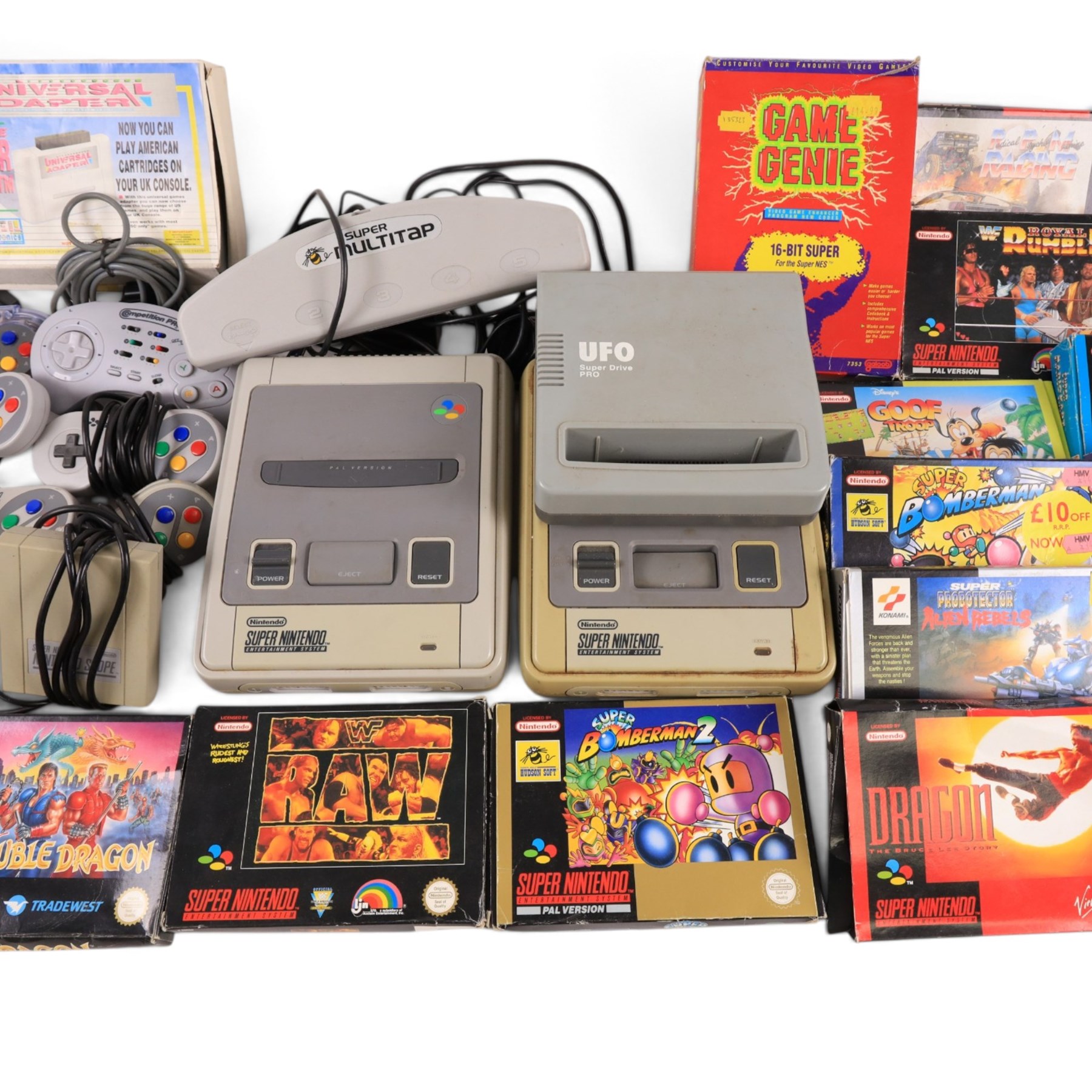Two Super Nintendo Entertainment System consoles, accessories to include Super Multitap, UFO Super Drive Pro, Universal Adapter, Game Genie, Scope 6 accessories (Scope not present), seven controllers including one Competition Pro and a SN Pro Pad and fifteen SNES games comprising eleven boxed and four unboxed examples, titles to include Dragon The Bruce Lee Story, Street Fighter II Turbo x2 (one unboxed), Royal Rumble, Super Mario Kart, Radical Psycho Machine Racing, Super Bomberman, Super Bomberman 2, Protector Alien Rebels, Double Dragon, Goof Troop, WWE Raw Wrestling, Tetris Attack, Donkey Kong Country and Starwing