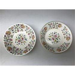 Minton Haddon Hall pattern tea and dinner wares, including basket dish, two covered tureens, six dinner plates, eight dessert plates, twelve tea plates, six soup bowls, six cereal bowls, teapot, coffee pot, milk jug, covered sucrier twelve tea cups and saucers, six mugs, footed bon bon dish, pair of candlestick holders, cake knife and slice etc (81)
