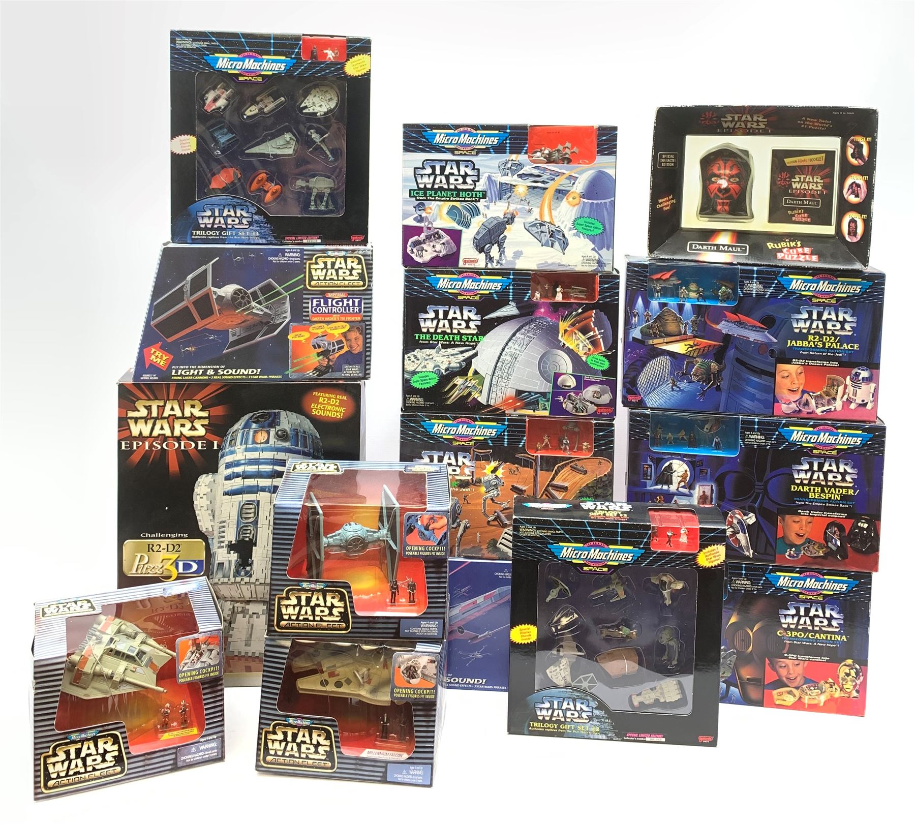 Star Wars - thirteen Galoob MicroMachines including Trilogy Gift Sets One & Two; C3PO/Cantina; Darth Vader/Bespin; R2-D2/Jabba's Palace; Ice Planet Hoth; The Death Star; Endor; Action Fleet Rebel Snowspeeder; Action Fleet Tie Fighter; Action Fleet Millenium Falcon; Flight Controller with Darth Vader's Tie Fighter and Flight Controller with Luke's X-Wing Starfighter; all boxed; together with Hasbro Episode 1 R2-D2 3-D Jig-saw puzzle, boxed in factory sealed transparent bag; and Hasbro Episode 1 Darth Maul Rubik's Cube puzzle, boxed (15)