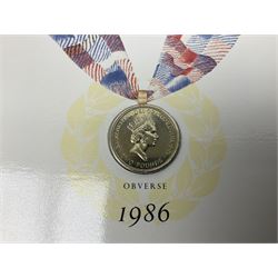 Two Great Britain and Northern Island proof sets dated 1970 and 1971, both with card cases, three 1986 Commonwealth Games commemorative two pound coins, in card folders, and six brilliant uncirculated one pound coins, in card folders