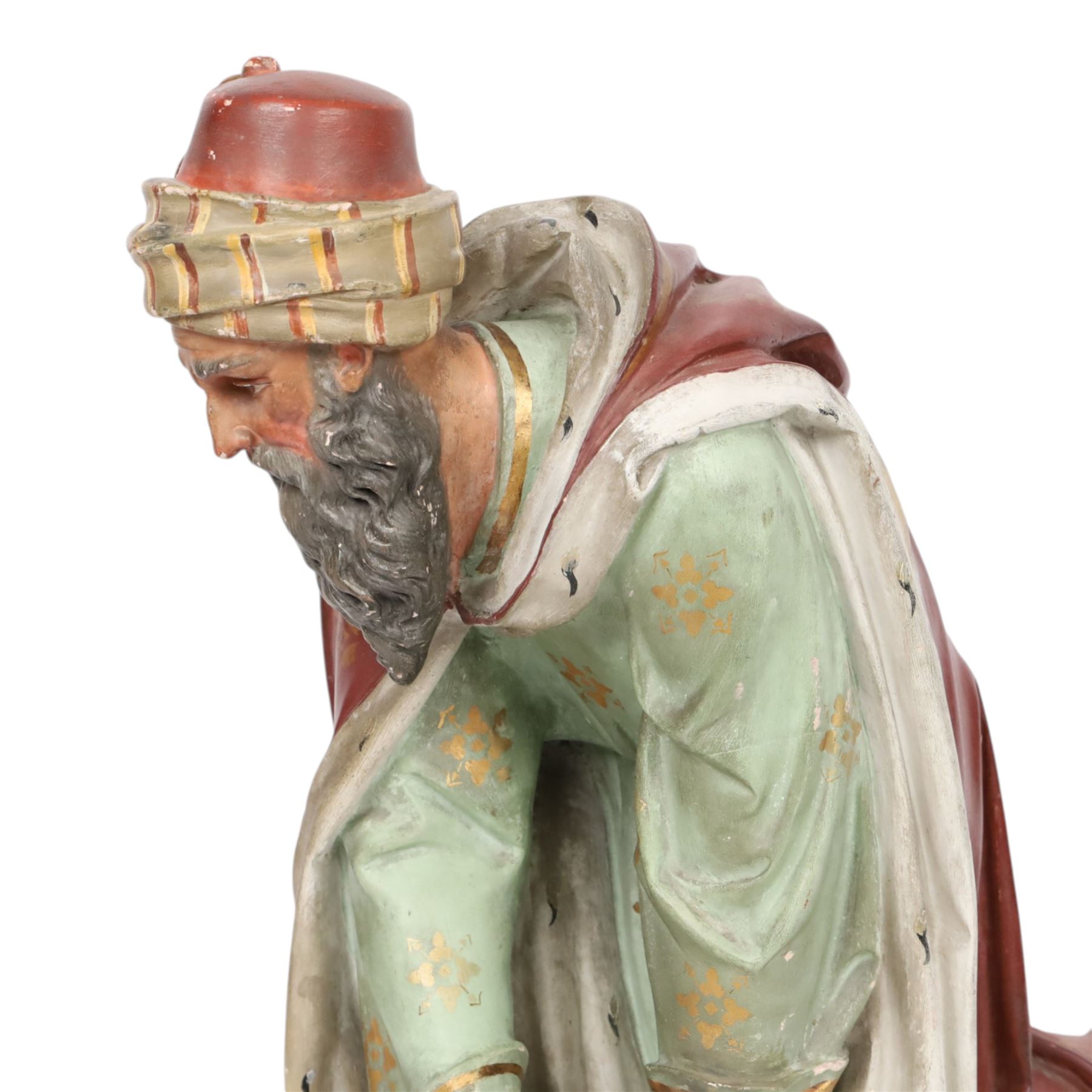 20th century painted plaster icon figure depicting one of the three wise men from a nativity sceen, kneeling and presenting his gift, H54cm 