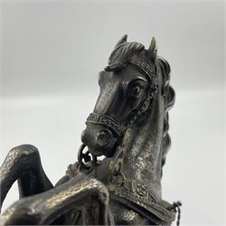 Modern silver model of a rearing horse, with ornate parcel gilt saddle and bridle, mounted upon a rectangular base, decorated with malachite panels to each side and upon four gilt bun feet, horse stamped 925, overall H14.5cm