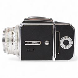 Hasselblad 500C medium format camera, serial no. TC60836, circa 1965, with Carl Zeiss Planar 1:2.8 f=80mm lens with cap, serial no. 4199654, one film back, serial no. TC87300 and a Hasselblad PM5 prism viewfinder serial no. 401EE1335