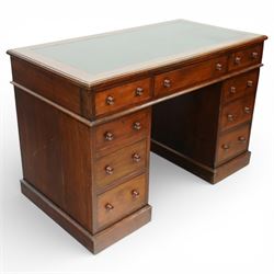 Victorian mahogany pedestal desk, rectangular moulded top inset with green leather writing surface with gilt tooling, fitted with three frieze drawers above opposing pedestals each fitted with three drawers, all with turned wooden knob handles, plinth bases