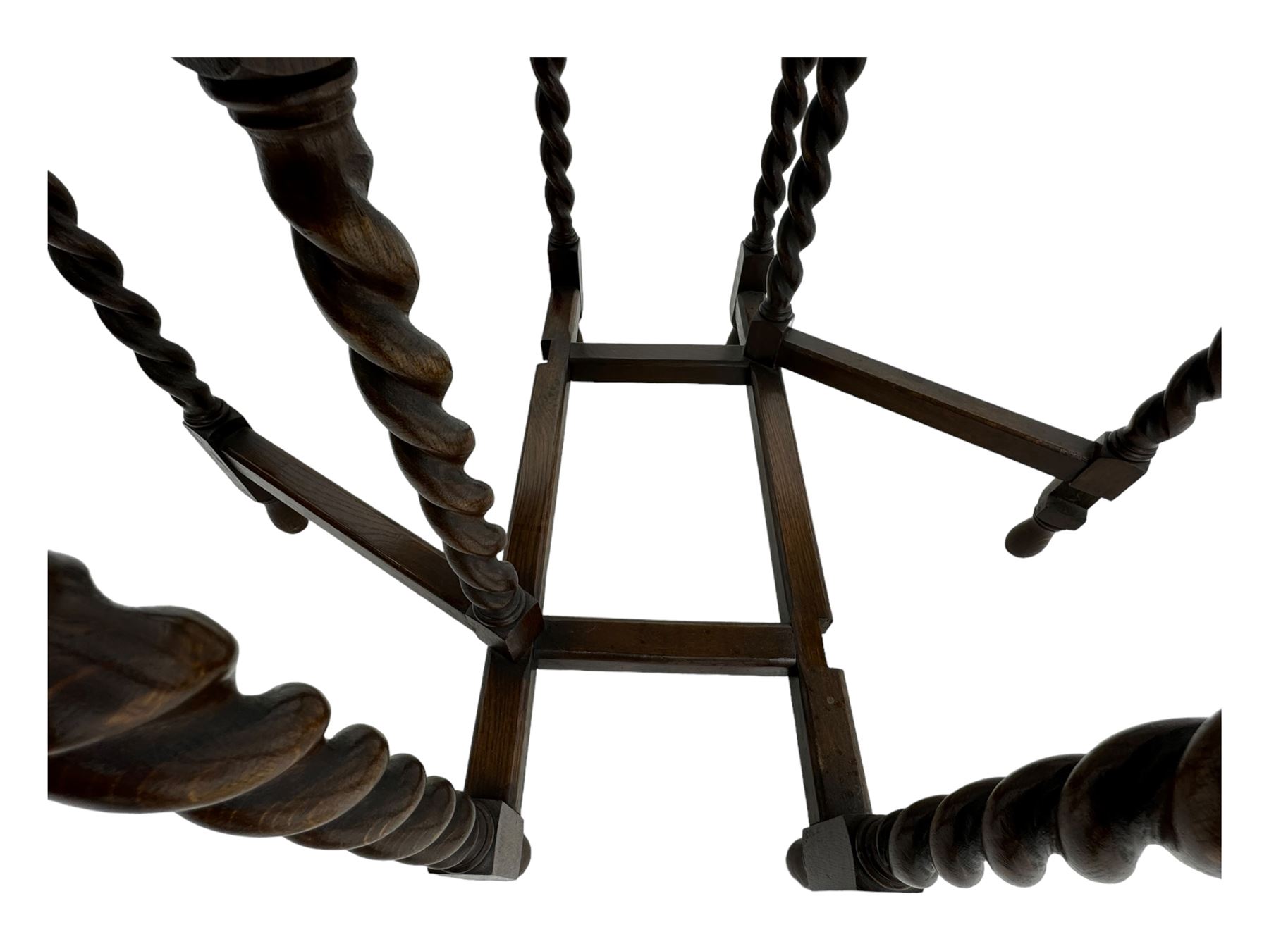 Early 20th century oak gateleg table, oval top with drop leaves supported by barley twist swing supports, united by plain stretchers, on turned feet (W119cm, D92cm, H77cm);
