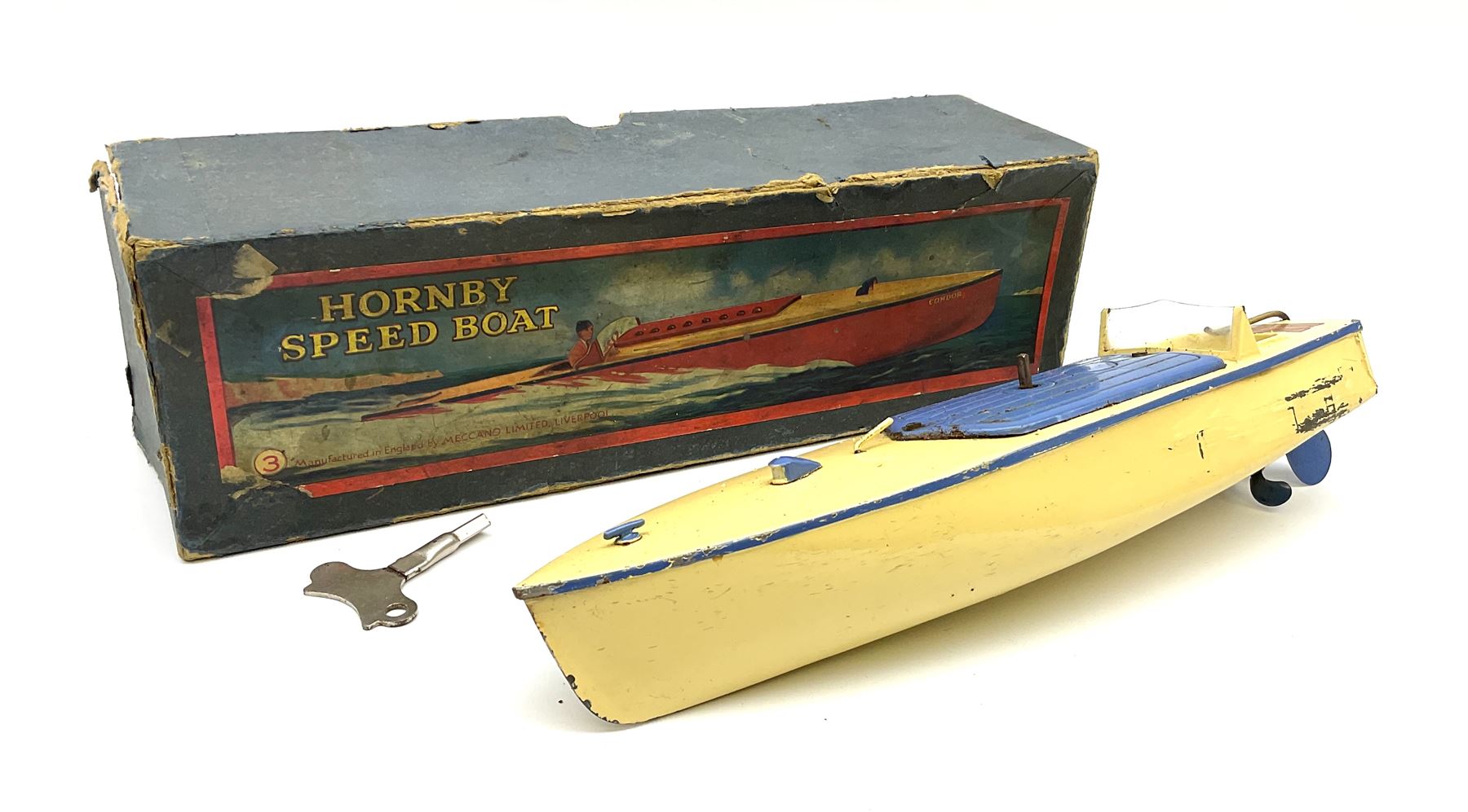 A boxed Hornby clockwork Speed Boat in cream and blue. Decorative