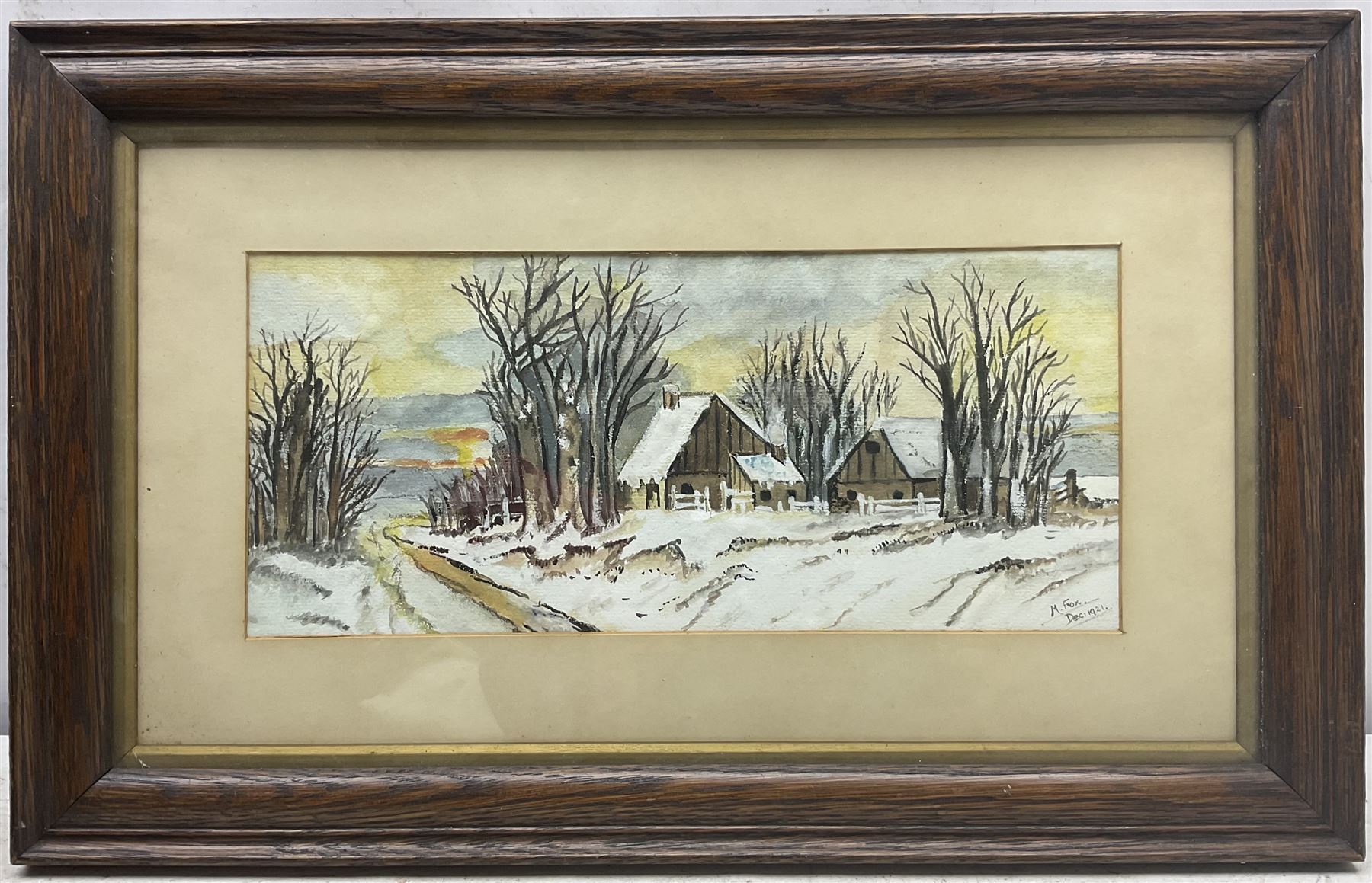 M Fox (British Early 20th Century): Winter Cottages at Dusk, watercolour signed and dated 1921, 15cm x 34cm