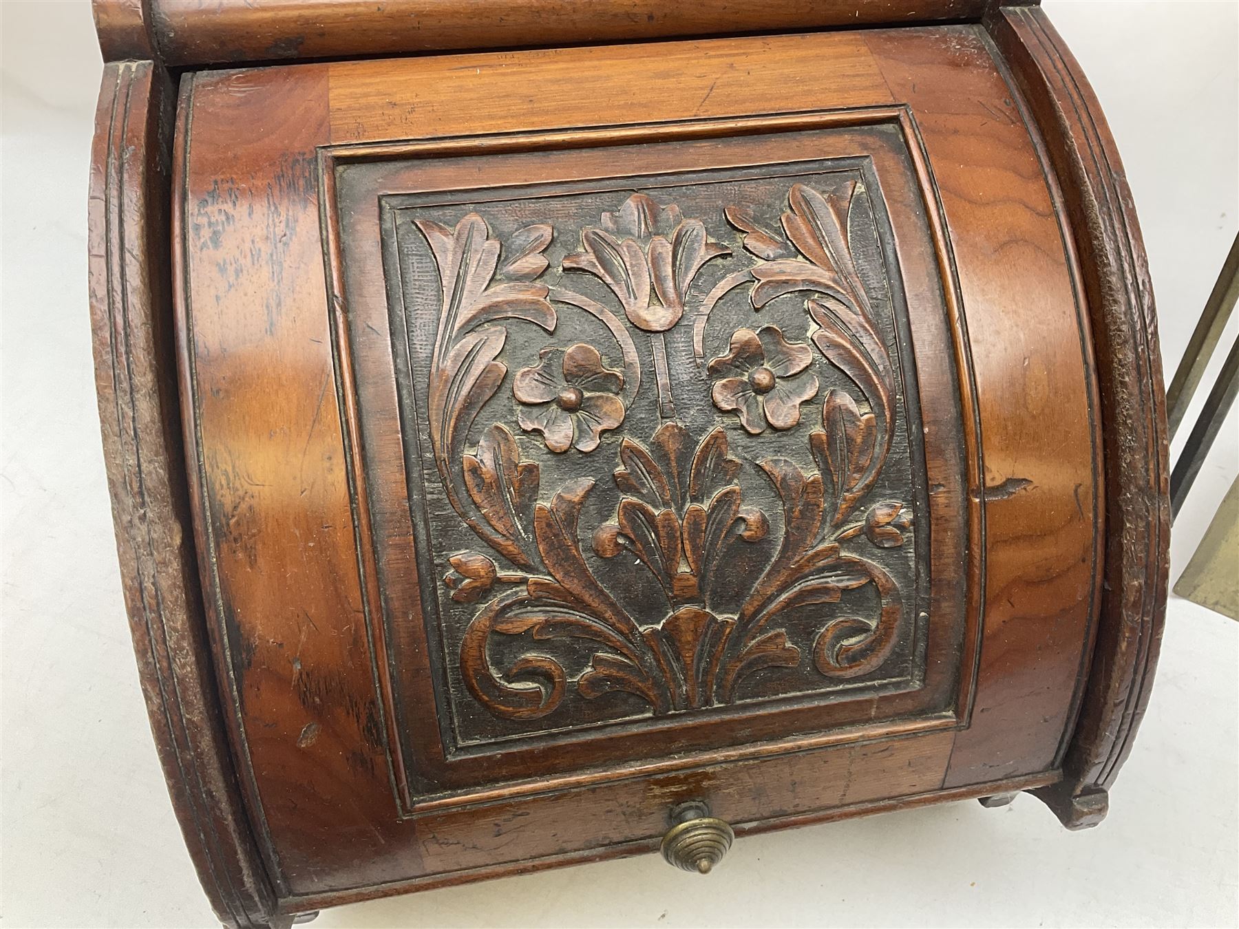 Victorian mahogany coal scuttle, the domed rolling lid carved with ornate foliate motifs opening to reveal interior with twin handled liner, mounted with carrying handle and shovel, together with brass fireside tools, largest H46cm