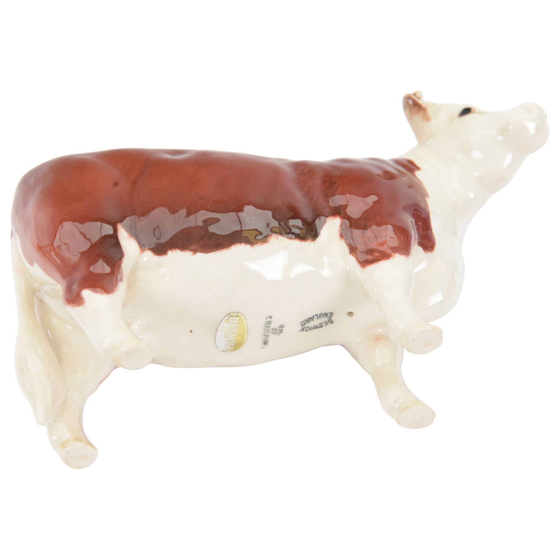Beswick Hereford cows family group, comprising Bull, Ch. of Champions 1363, Hereford cow Ch of Champion 1360, and calf 1827, together with another Hereford Bull