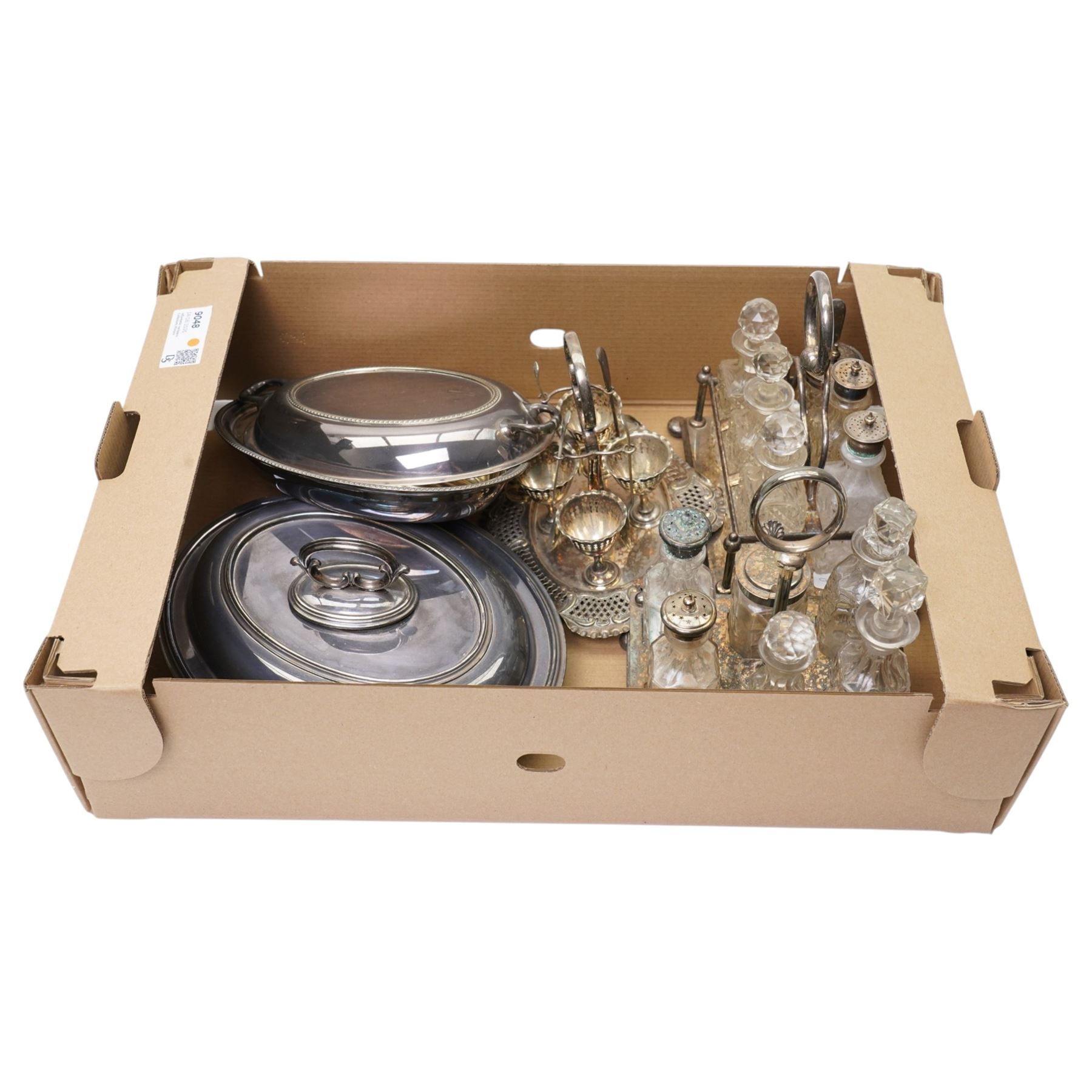 Two glass and silver plated six bottle cruets, plated egg cruet and two entree dishes