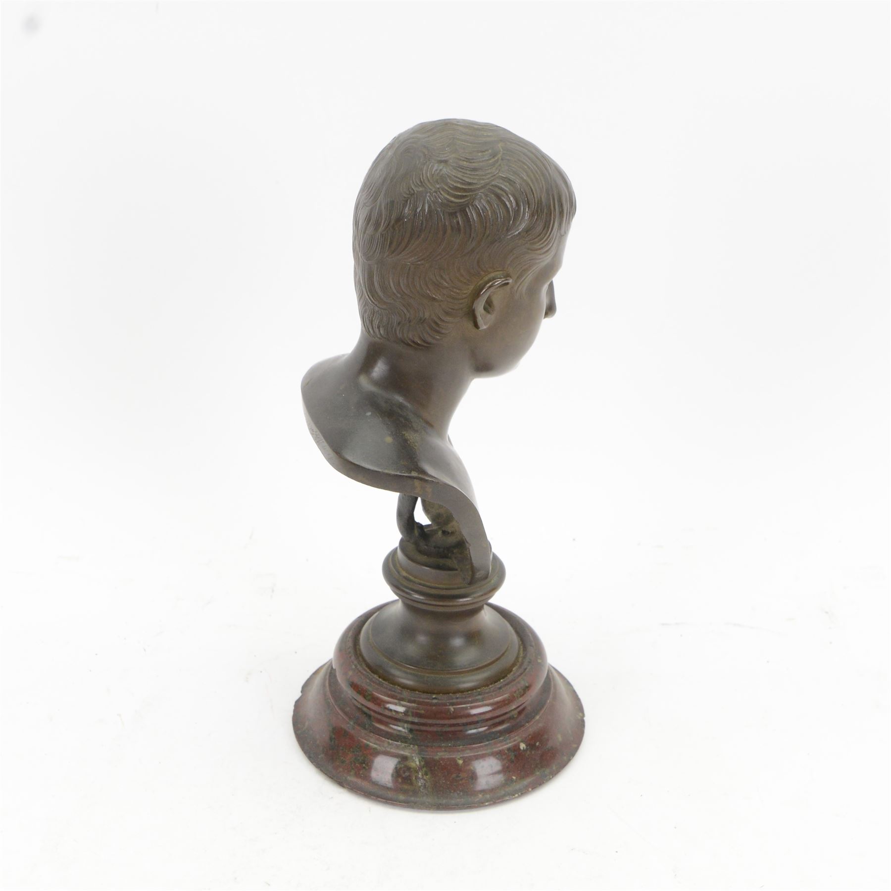 After the Antique, mid/late 19th century bronze portrait bust of a young Julius Caesar, upon a bronze waisted socle, signed L SALVAGGI ROMA, and circular stepped red marble plinth, overall H30.5cm
