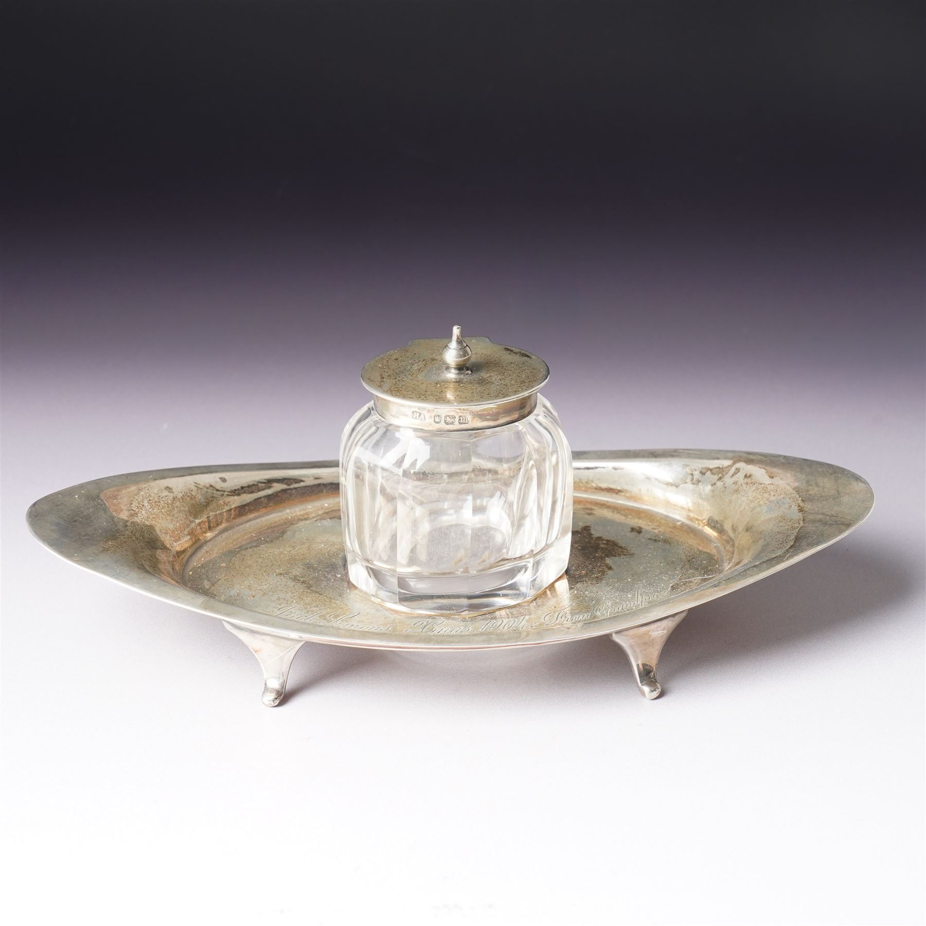 Edwardian silver navette shape inkstand with silver mounted glass inkwell, presentation inscription and splay feet L20cm Sheffield 1904 Maker Atkin Bros