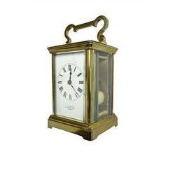 W.R. Cullen, London Street. Norwich. - 8-day French carriage clock c1900, in a corniche case with carrying handle and four bevelled glass panels, white enamel dial with Roman numerals, minute markers and spade hands, with a lever platform escapement and rack striking movement striking the hours and half hours on a coiled gong. 