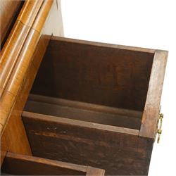 George II figured walnut chest-on-stand, the moulded cavetto top over two short and three long graduating cross-banded drawers, each fitted with pressed brass handle plates, the base fitted with three further drawers over a shaped apron, raised on cabriole supports with pad feet