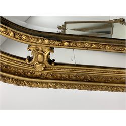 Gilt Rococo style mirror, arched top with central cartouche and oak leaf moulded pediment, floral and fruit moulded surround with segmented glass panels, bevelled central pane, c-scroll shell and acanthus leaf brackets