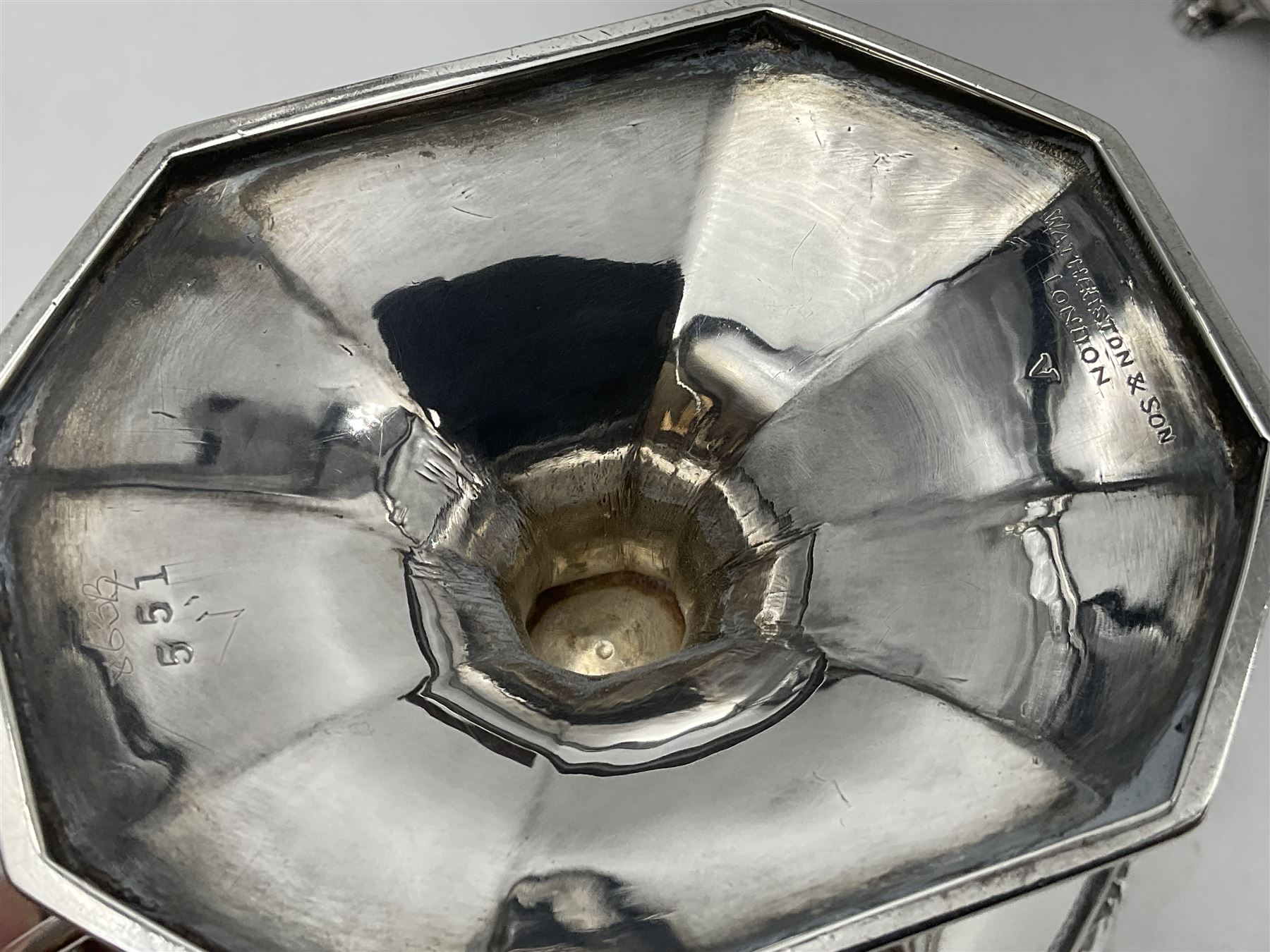 Victorian silver four piece tea service, comprising teapot, teapot stand, twin handled open sucrier and milk jug, each of octagonal form with foliate bud border and engraved decoration including crest to canted panels, and vacant panels, the teapot with ivory finial to the hinged cover and later wooden handle, hallmarked Edward Barnard & Sons Ltd, London1896, teapot including finial H15cm, milk jug including handle H16cm, teapot stand W11.5cm

This item has been registered for sale under Section 10 of the APHA Ivory Act